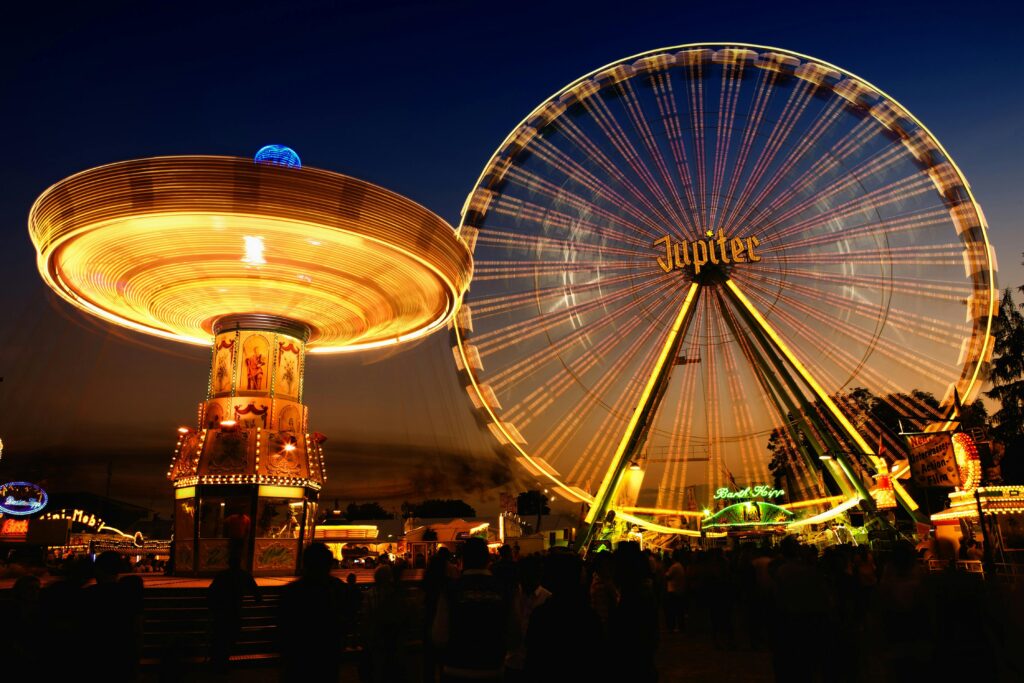 Capture the magic of a night carnival. Bright lights and thrilling rides create a captivating scene.